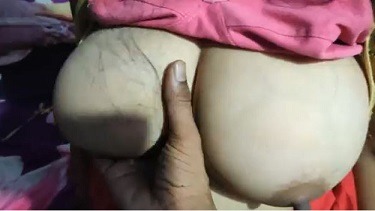 Feeding milk from big breast of maid